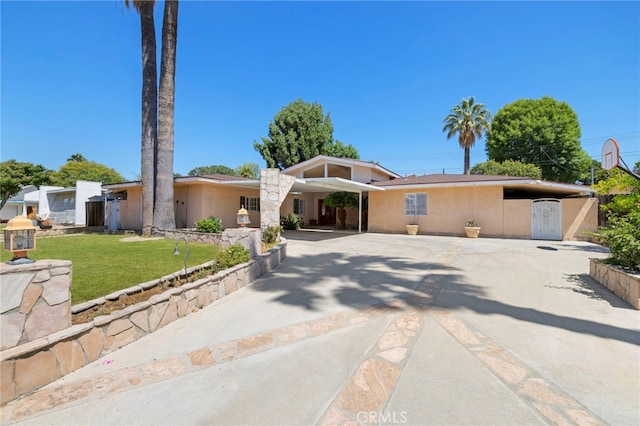 18409 Los Alimos St, Porter Ranch, CA 91326 - view of front facade with a front lawn, concrete driveway, and stucco siding