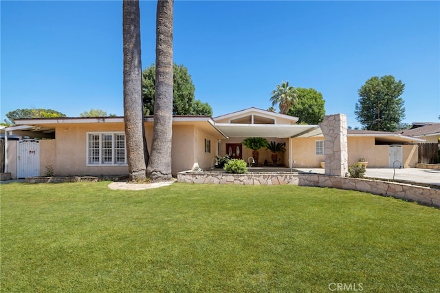 18409 Los Alimos St, Porter Ranch, CA 91326 - view of front of house with stucco siding and a front yard