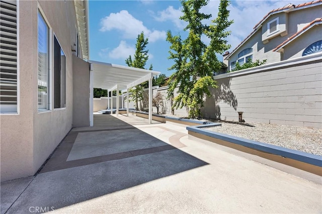 7020 Julie Ln, San Gabriel, CA 91775 - fenced backyard with a patio area and a wall mounted air conditioner