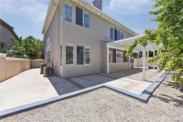 7020 Julie Ln, San Gabriel, CA 91775 - rear view of property with a patio area, a chimney, and stucco siding