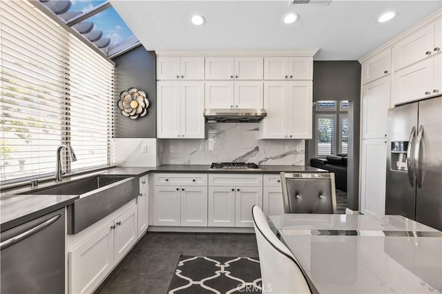 7020 Julie Ln, San Gabriel, CA 91775 - kitchen featuring appliances with stainless steel finishes, recessed lighting, under cabinet range hood, backsplash, and white cabinets