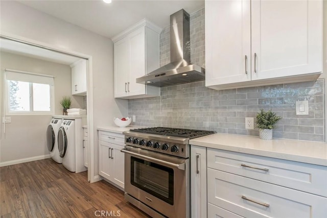 341 Cumberland Rd, Glendale, CA 91202 - kitchen with stainless steel stove, wall chimney exhaust hood, washer and dryer, white cabinets, and light countertops