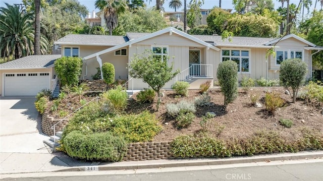341 Cumberland Rd, Glendale, CA 91202 - ranch-style house with board and batten siding, concrete driveway, and a garage