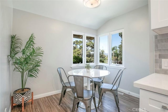 341 Cumberland Rd, Glendale, CA 91202 - dining room featuring wood finished floors and vaulted ceiling