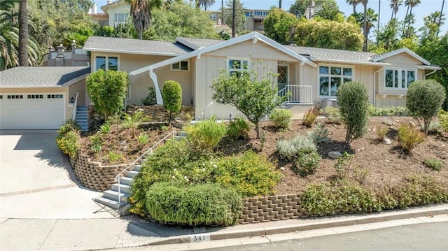341 Cumberland Rd, Glendale, CA 91202 - single story home with board and batten siding, driveway, and an attached garage