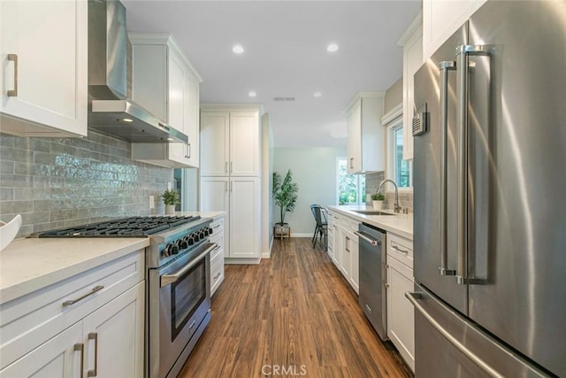 341 Cumberland Rd, Glendale, CA 91202 - kitchen with high quality appliances, wall chimney exhaust hood, dark wood-type flooring, recessed lighting, and white cabinets