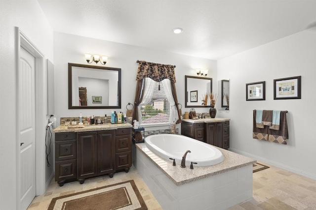 3024 Natureview Ct, Chula Vista, CA 91914 - bathroom featuring two vanities, a garden tub, and recessed lighting