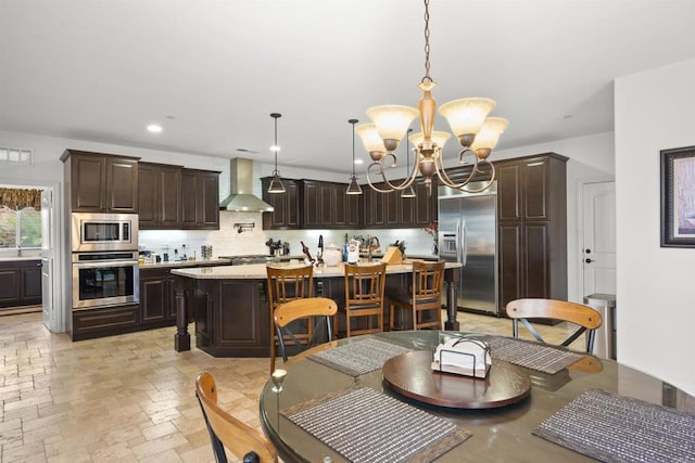 3024 Natureview Ct, Chula Vista, CA 91914 - dining area with a chandelier, stone tile floors, and recessed lighting