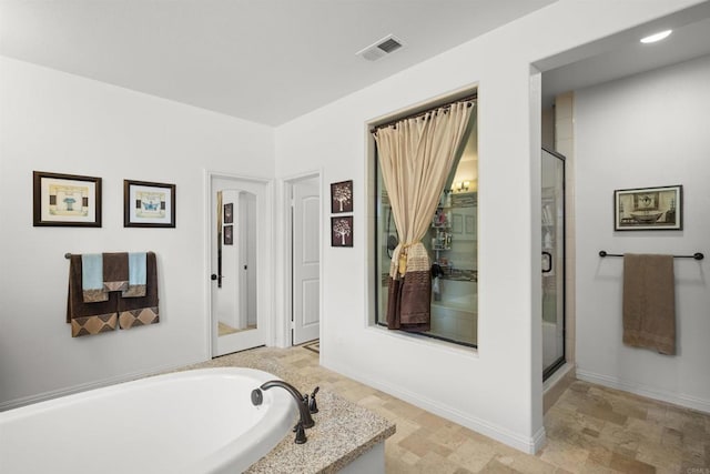 3024 Natureview Ct, Chula Vista, CA 91914 - bathroom with a stall shower, a garden tub, and stone finish flooring