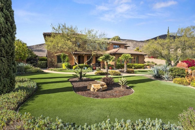 3024 Natureview Ct, Chula Vista, CA 91914 - rear view of property with a tiled roof, a lawn, stucco siding, and a mountain view