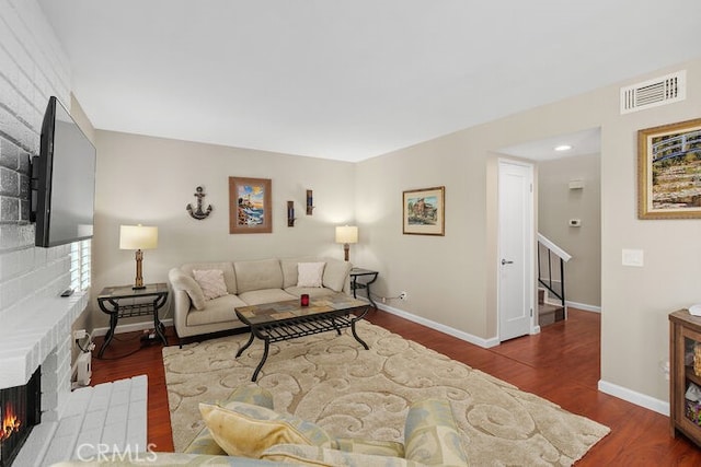 32332 Calle Linda, Dana Point, CA 92629 - living area featuring stairs, wood finished floors, and a fireplace