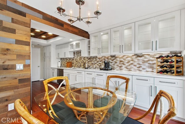 32332 Calle Linda, Dana Point, CA 92629 - kitchen featuring tasteful backsplash, white cabinetry, light countertops, dark wood-style floors, and wood walls