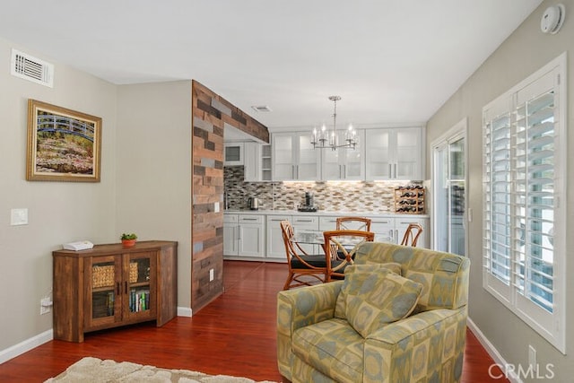 32332 Calle Linda, Dana Point, CA 92629 - dining room with healthy amount of natural light, a chandelier, and dark wood-type flooring
