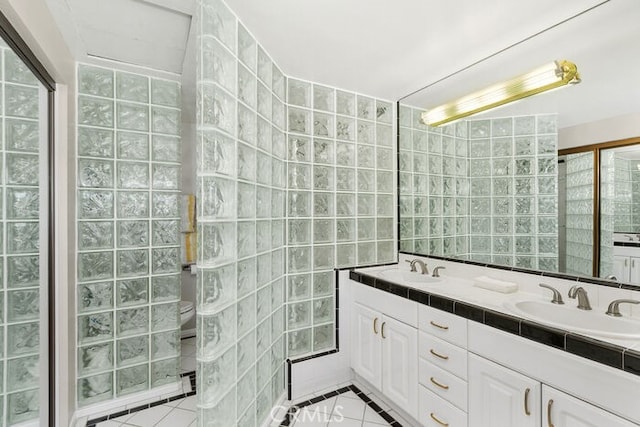 32332 Calle Linda, Dana Point, CA 92629 - bathroom featuring tile walls, double vanity, and tile patterned flooring