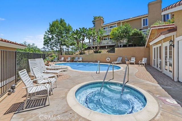 32332 Calle Linda, Dana Point, CA 92629 - community pool with french doors, a community hot tub, and a patio area