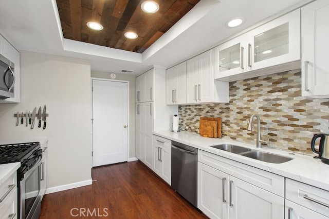 32332 Calle Linda, Dana Point, CA 92629 - kitchen with a raised ceiling, appliances with stainless steel finishes, wooden ceiling, light countertops, and white cabinets