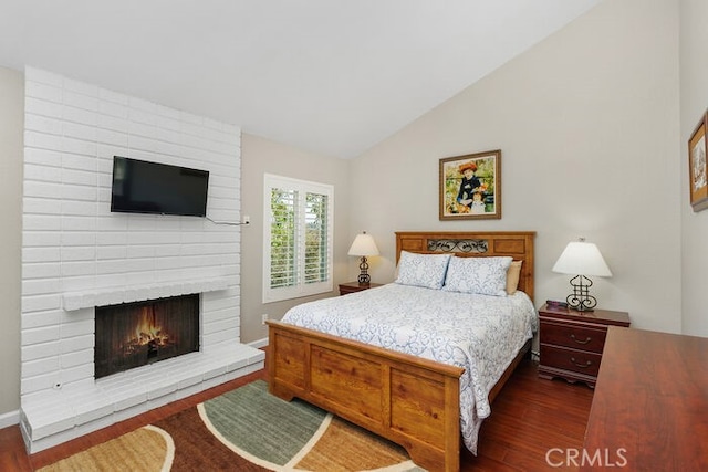 32332 Calle Linda, Dana Point, CA 92629 - bedroom featuring dark wood finished floors, a fireplace, and vaulted ceiling