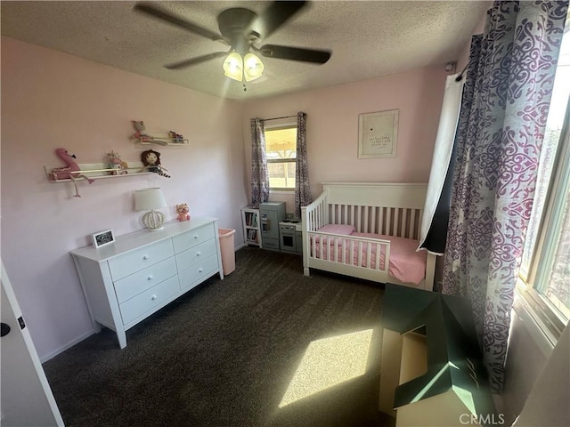 1024 W Pine St, West Covina, CA 91790 - bedroom featuring a textured ceiling, dark carpet, and ceiling fan