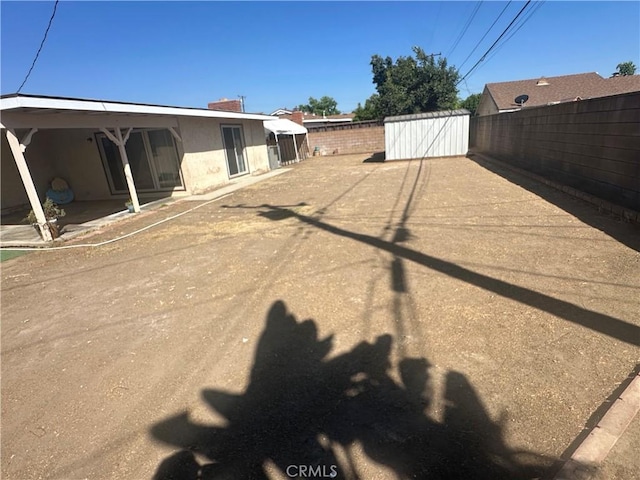 1024 W Pine St, West Covina, CA 91790 - fenced backyard with a storage unit