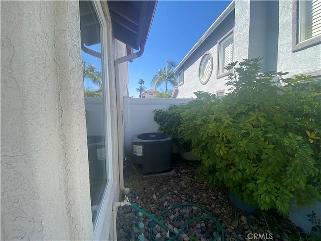 1853 Corte Pulsera, Oceanside, CA 92056 - exterior view of stucco siding and a central air condition unit