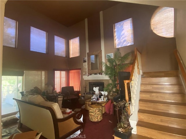 1853 Corte Pulsera, Oceanside, CA 92056 - staircase with wood finished floors, a fireplace, and a towering ceiling