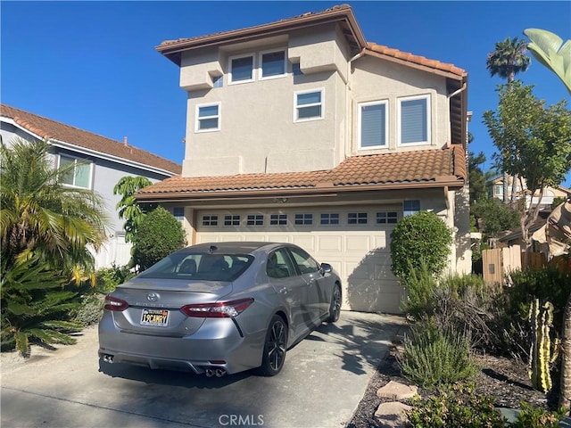 1853 Corte Pulsera, Oceanside, CA 92056 - view of front of property with concrete driveway, an attached garage, a tile roof, and stucco siding