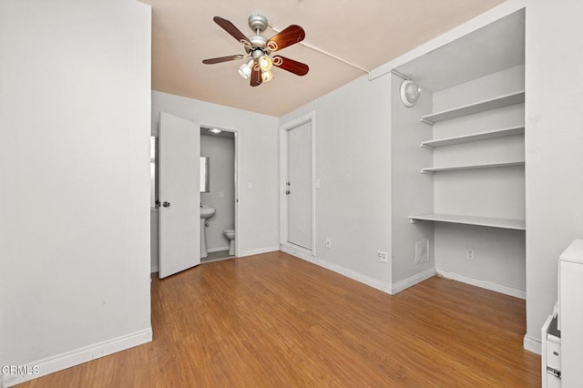 489 W Summerfield Cir, Anaheim, CA 92802 - empty room featuring ceiling fan, wood finished floors, and built in desk