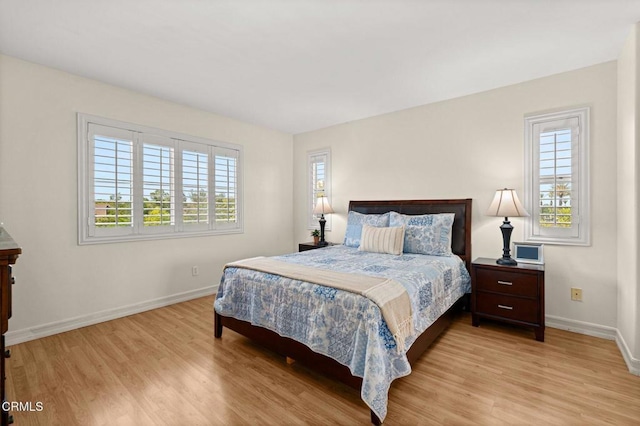 489 W Summerfield Cir, Anaheim, CA 92802 - bedroom featuring multiple windows and light wood finished floors