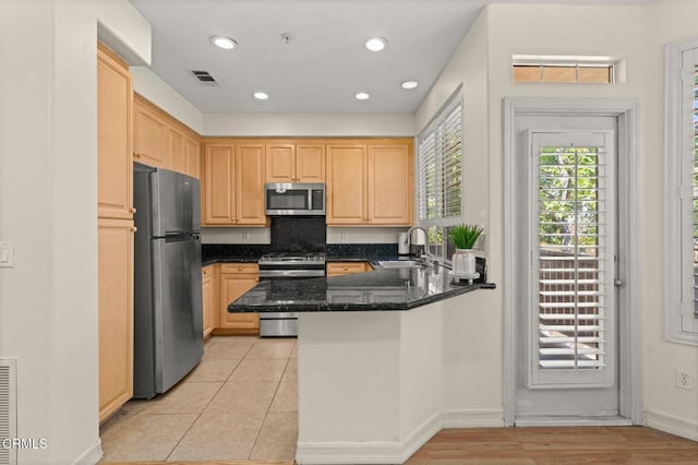 489 W Summerfield Cir, Anaheim, CA 92802 - kitchen featuring appliances with stainless steel finishes, light brown cabinets, a peninsula, dark stone counters, and recessed lighting