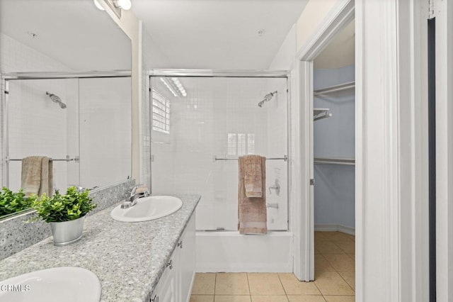 489 W Summerfield Cir, Anaheim, CA 92802 - bathroom with tile patterned floors, double vanity, enclosed tub / shower combo, and a walk in closet