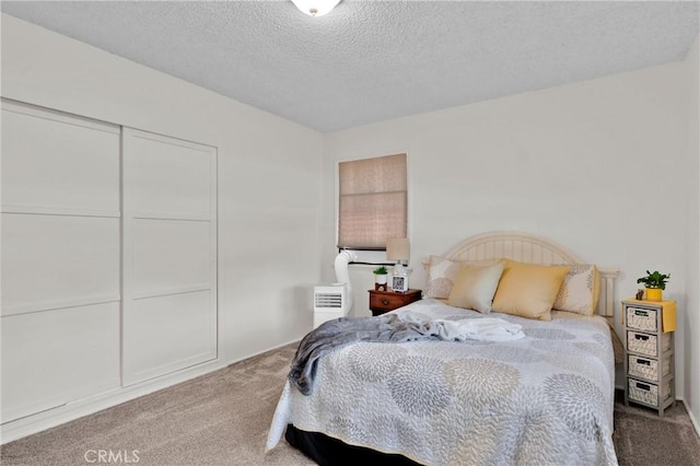 6032 Coke Ave, Long Beach, CA 90805 - bedroom with carpet flooring, a textured ceiling, and a closet