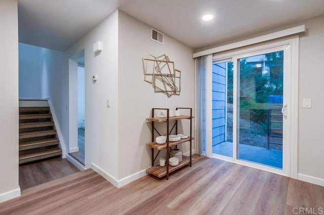 11033 Scripps Ranch Blvd, San Diego, CA 92131 - unfurnished room featuring wood finished floors and stairway