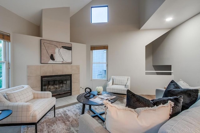 11033 Scripps Ranch Blvd, San Diego, CA 92131 - living area featuring a tile fireplace, plenty of natural light, and high vaulted ceiling