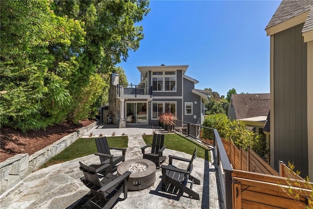 31675 Via Pato, Coto De Caza, CA 92679 - back of house with a balcony, a patio, a fire pit, and a chimney