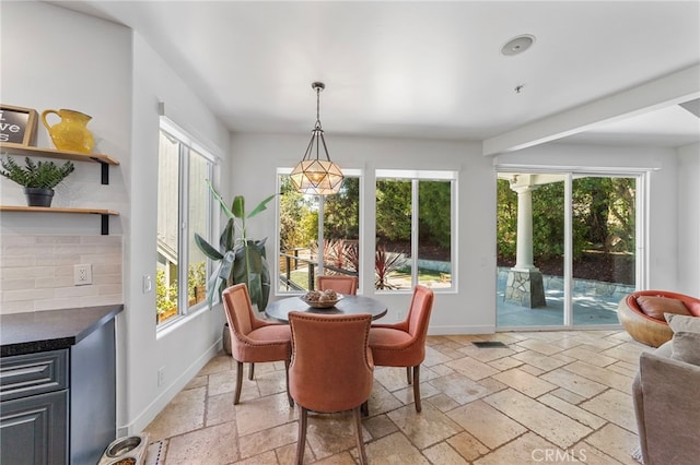31675 Via Pato, Coto De Caza, CA 92679 - dining space featuring stone tile floors, plenty of natural light, and a fireplace