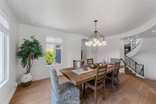 31675 Via Pato, Coto De Caza, CA 92679 - dining area featuring light wood-style floors, stairs, and a chandelier