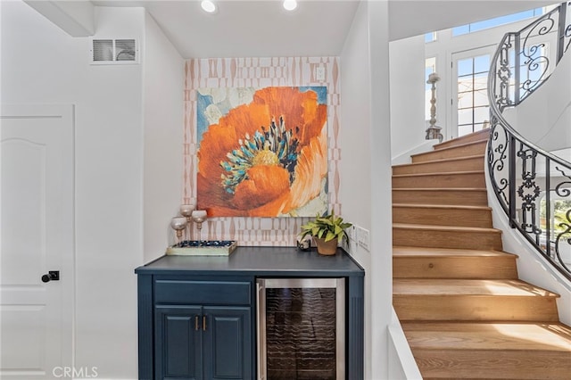 31675 Via Pato, Coto De Caza, CA 92679 - stairs featuring beverage cooler, healthy amount of natural light, recessed lighting, a dry bar, and an accent wall