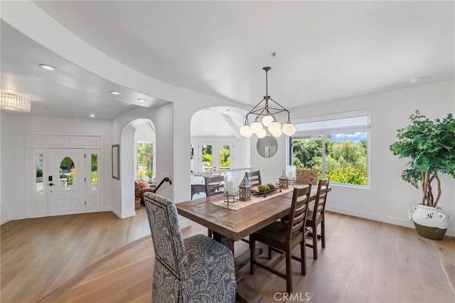 31675 Via Pato, Coto De Caza, CA 92679 - dining space with arched walkways, light wood-style floors, and recessed lighting