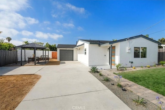 1708 Loretta St, Oceanside, CA 92058 - view of front facade with a gazebo, concrete driveway, stucco siding, and an attached garage