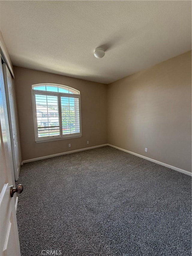 4125 Sattui Ct, Merced, CA 95348 - empty room featuring carpet flooring and a textured ceiling