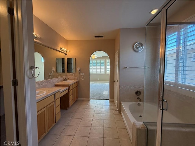 4125 Sattui Ct, Merced, CA 95348 - bathroom with a bath, tile patterned floors, double vanity, and a stall shower