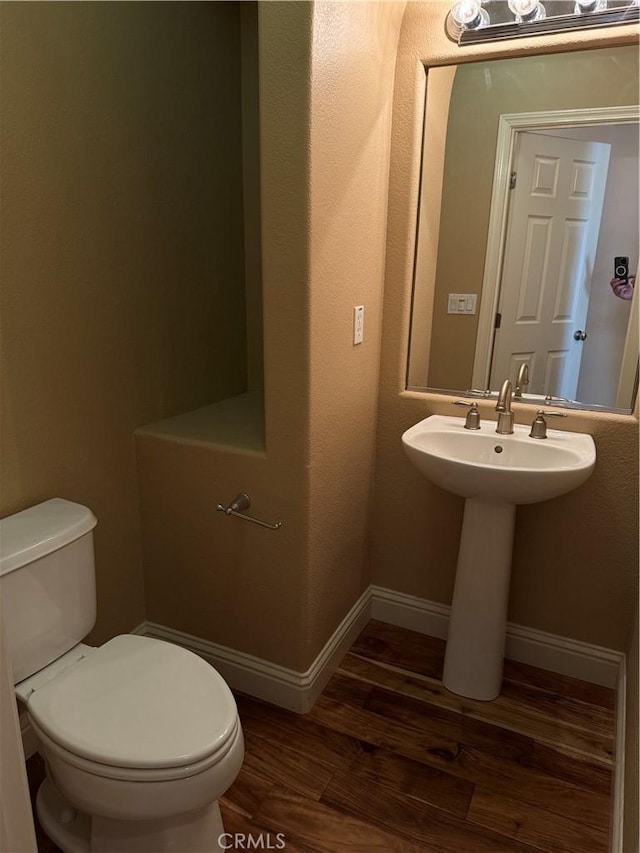 4125 Sattui Ct, Merced, CA 95348 - half bath featuring toilet and wood finished floors