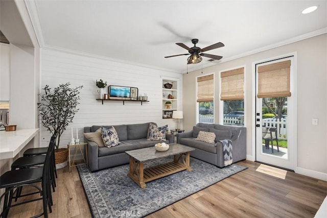 42 Livingston Pl, Ladera Ranch, CA 92694 - living area with ceiling fan, wood finished floors, ornamental molding, and built in features