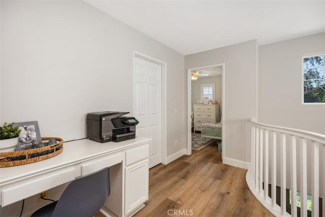 42 Livingston Pl, Ladera Ranch, CA 92694 - office area featuring light wood-style floors, built in desk, and plenty of natural light
