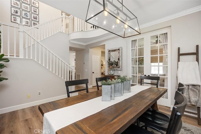 42 Livingston Pl, Ladera Ranch, CA 92694 - dining area featuring stairway, wood finished floors, and crown molding
