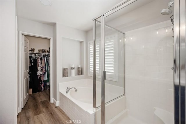 42 Livingston Pl, Ladera Ranch, CA 92694 - full bath with a shower stall, a garden tub, a spacious closet, and wood finished floors