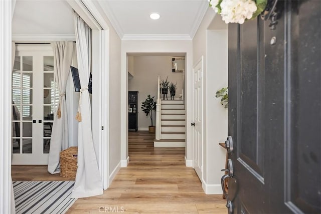 42 Livingston Pl, Ladera Ranch, CA 92694 - entryway featuring light wood-type flooring, ornamental molding, stairs, and recessed lighting