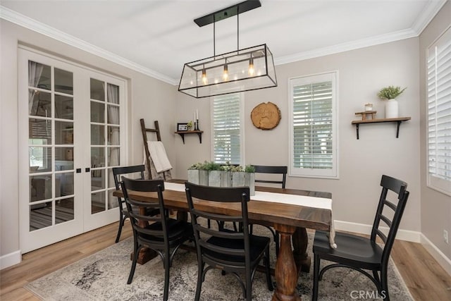 42 Livingston Pl, Ladera Ranch, CA 92694 - dining space featuring french doors, wood finished floors, and crown molding