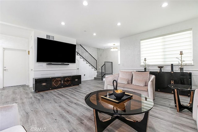 9124 N Nilo Ln, Panorama City, CA 91402 - living room featuring light wood-style floors, stairs, and recessed lighting