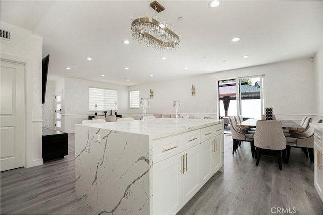 9124 N Nilo Ln, Panorama City, CA 91402 - kitchen with white cabinetry, recessed lighting, plenty of natural light, and light wood-style flooring